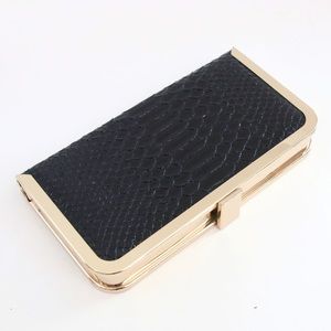 Glint Womens snake skin clutch black and gold